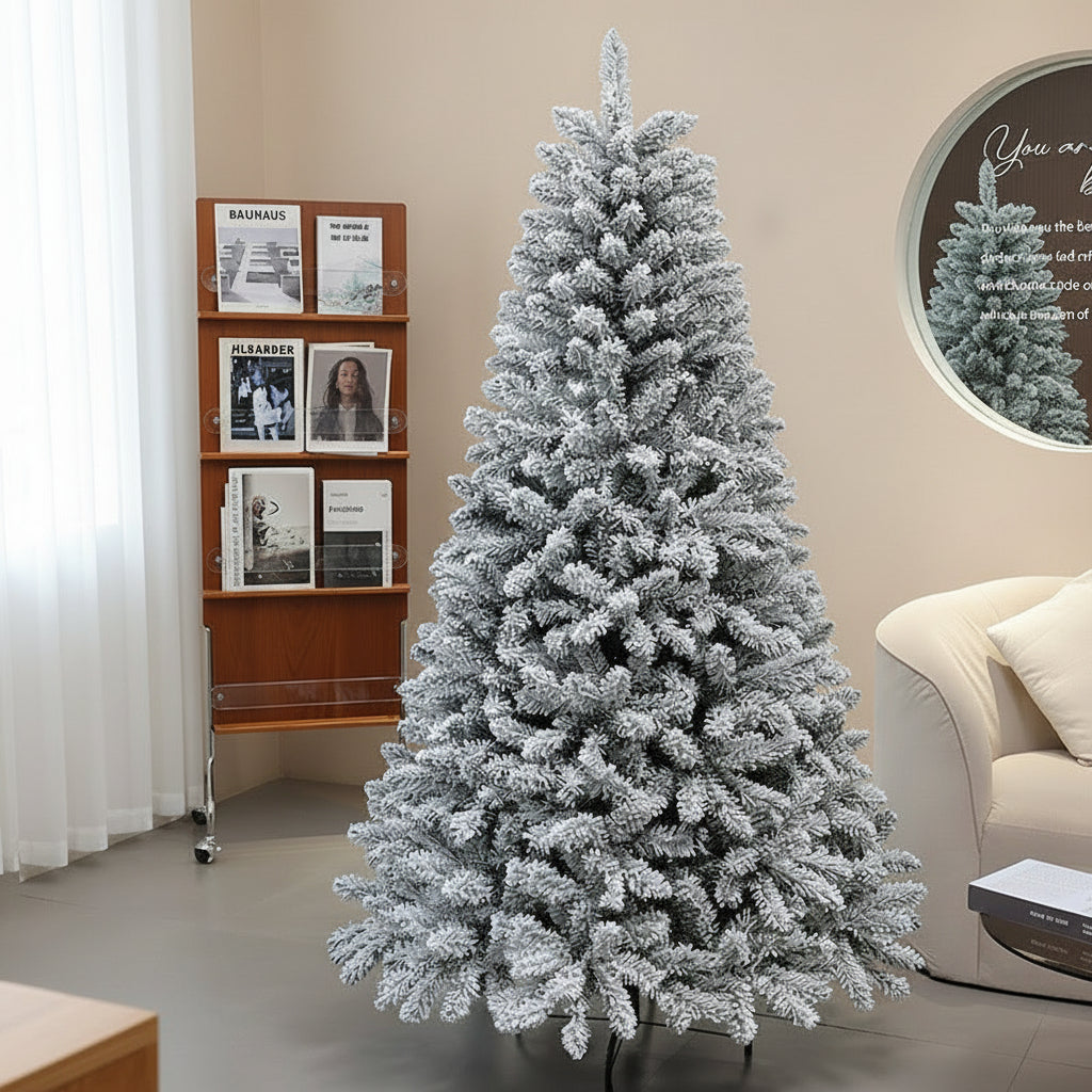 Frosted Christmas tree in a living room setting with a bookshelf and sofa.