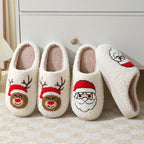 Four pairs of white slippers with Santa and reindeer designs on a light background.