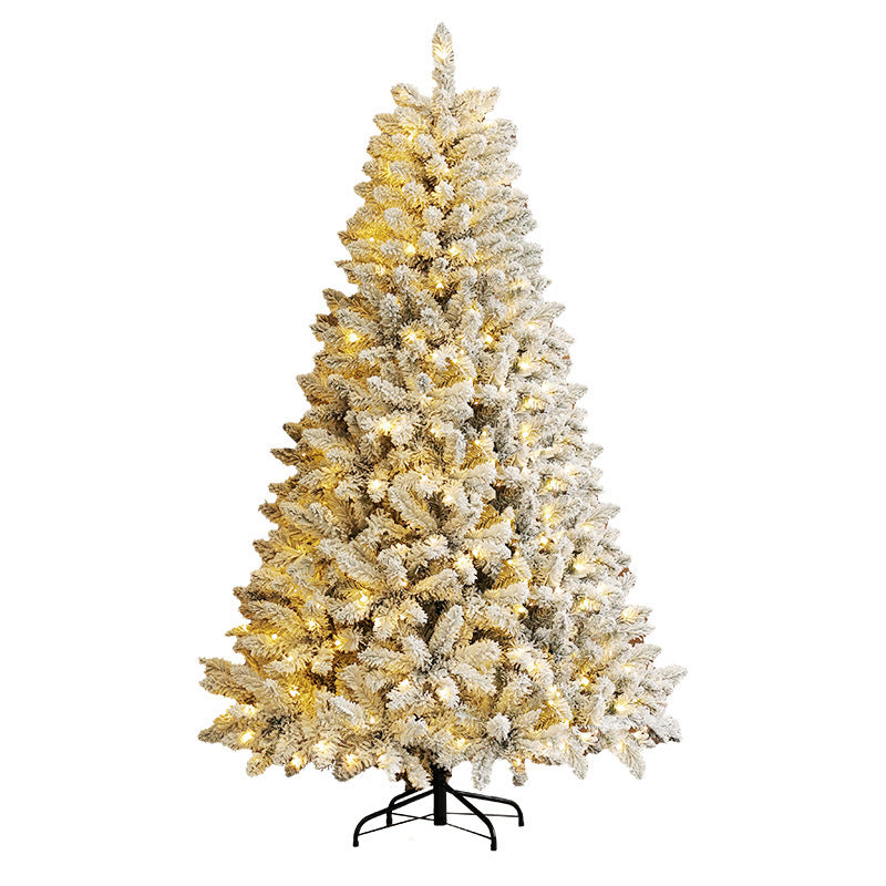 Decorated snow-flocked Christmas Tree with lights on a white background